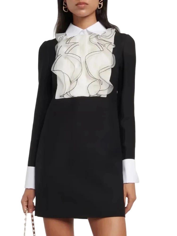 A collaged ruffle midi dress with artistic tailoring