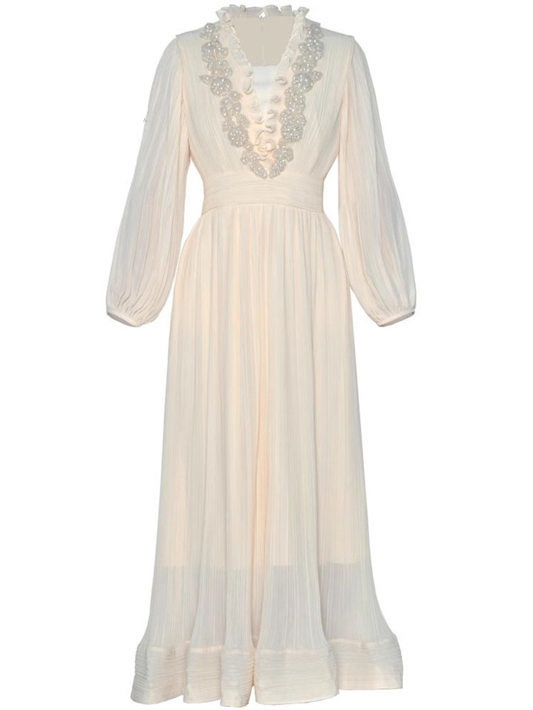 An elegant beaded swing dress with lantern sleeves